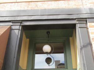 2489 W Main Coors Bldg Tuscan order Cast Iron Secondary Entrance Crony_new